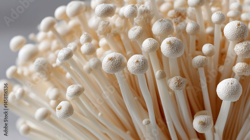 Golden Enoki Mushrooms: Close-up view of a cluster of fresh, golden enoki mushrooms.