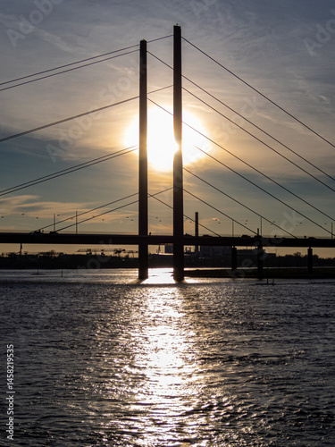 Obraz na płótnie Bridge on Rhine with interesting sky on sunset w salonie