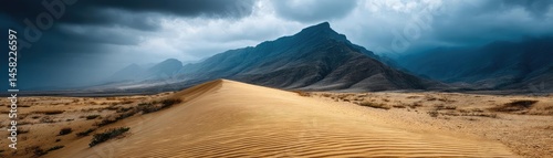 Obraz na płótnie Panorama sand storm over huge dune with powerful wind wave concept. Expansive desert landscape with mountains under dramatic skies. w salonie