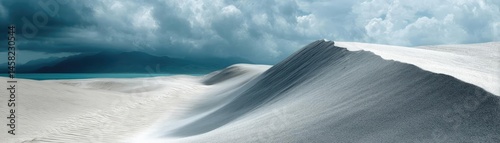 Obraz na płótnie Panorama sand storm with dark clouds above arid dunes concept. Stunning sand dunes under dramatic clouds and a tranquil sea. w salonie