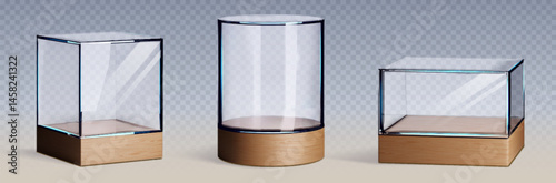 Glass museum display cases with wood bases - minimalist three sizes of transparent exhibition cubes on wooden pedestals. Empty glass boxes showcase products or artifacts in galleries, retail stores.