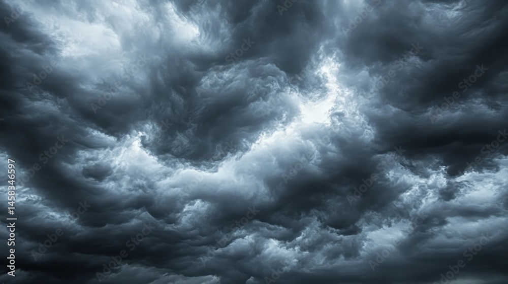 Obraz premium Dramatic storm clouds dark gray and blue swirling sky texture