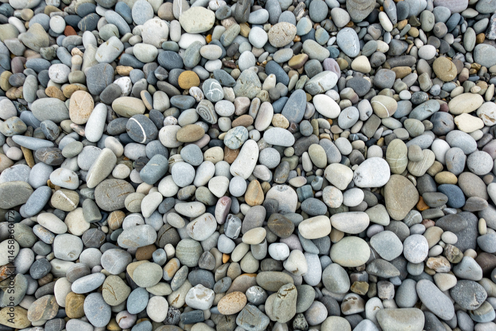 A pile of rocks with a single rock in the middle A pile of rocks with a single rock in the middle