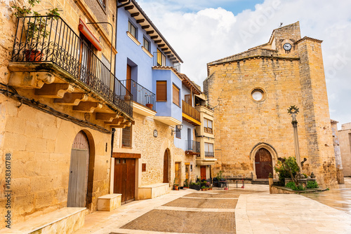 Obraz na płótnie Main square with old stone church in the medieval village of Matarrana, Teruel. w salonie