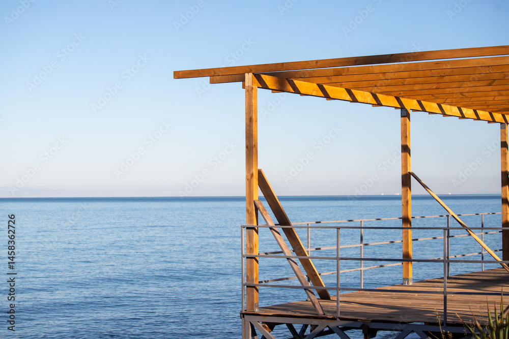 A wooden structure with a view of the ocean A wooden structure with a view of the ocean