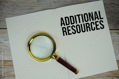 Additional Resources text written on chalkboard with alarm clock on wooden background