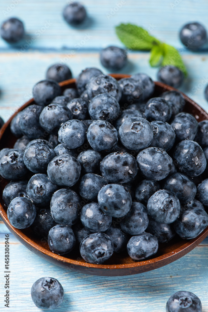 fresh blueberry fruit on woooden table.