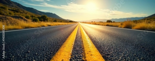 - Harsh sunlight on coarse blacktop, vibrant yellow road markings recede to distant vanishing point , horizon, vanishing point