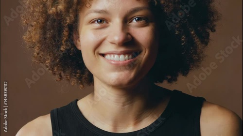 Portrait of a Person with Curly Hair and a Smile