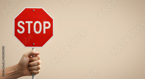 hand holding stop sign