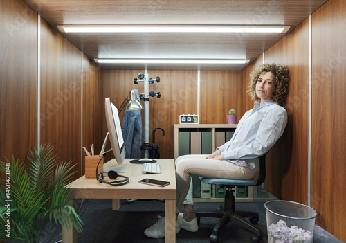 Portrait of a businesswoman working in a small minimalist office