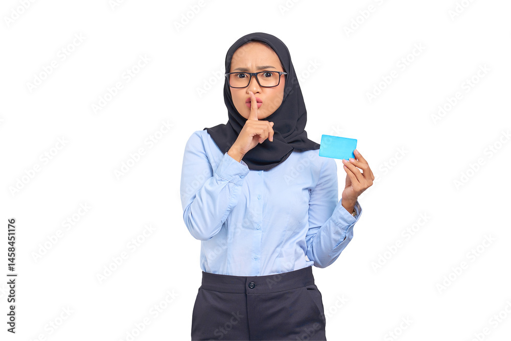 Portrait of pretty young Asian woman holds a credit card and makes silent gesture isolated on transparent background Portrait of pretty young Asian woman holds a credit card and makes silent gesture isolated on transparent background