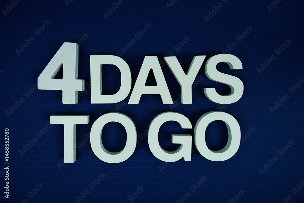 4 Days to go alphabet letters top view on navy blue background 4 Days to go alphabet letters top view on navy blue background