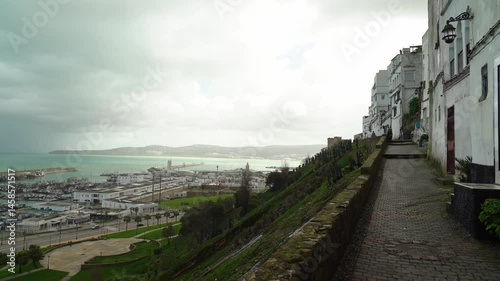 Sunlight illuminates the details of Bab El Marsa in Tangier, Morocco, highlighting its beauty and historical significance by the waterfront