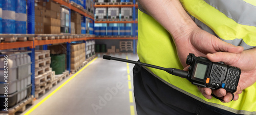 Cuadro en lienzo Walkie-talkie in hands of warehouse worker