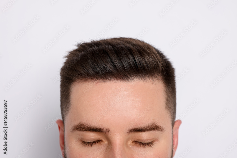 Fototapeta premium Man after hair loss treatment on light background, closeup