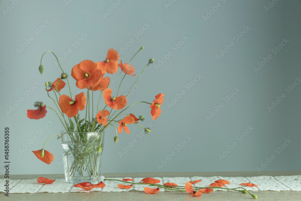 bouquet of red poppies in glass