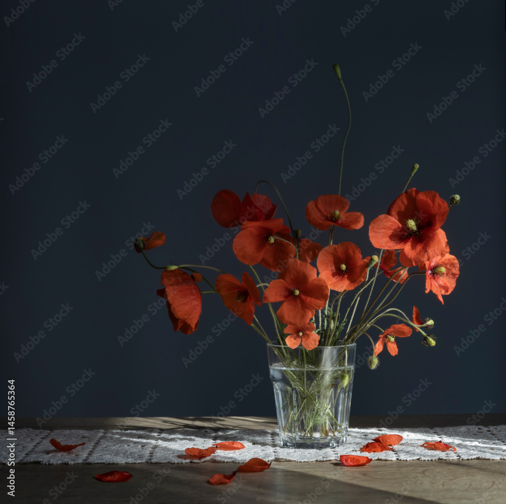 bouquet of red poppies in glass