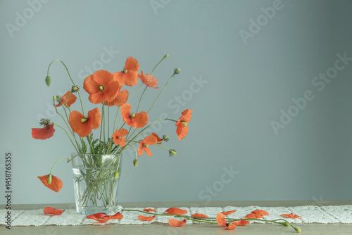 bouquet of red poppies in glass