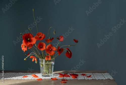 bouquet of red poppies in glass