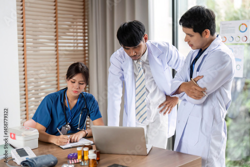 Medical professionals engaged in a collaborative analysis of patient data