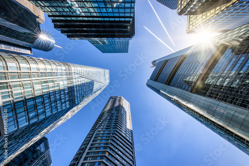 Looking directly up at the skyline of the financial district in central Frankfurt, Germany, modern architecture as a background