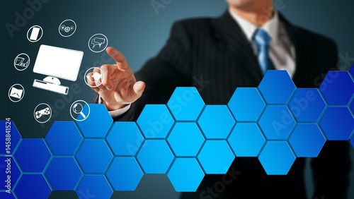A businessman's hand interacts with a digital interface, displaying various application icons (email, computer, phone, etc.) hovering above a backdrop of interconnected, gradient blue hexagons.
