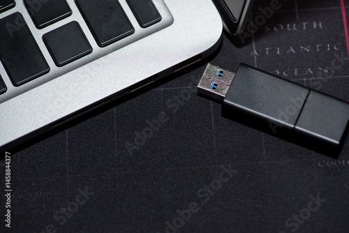Vászonkép Hand inserting Flash drive memory drive plugged into a computer laptop port