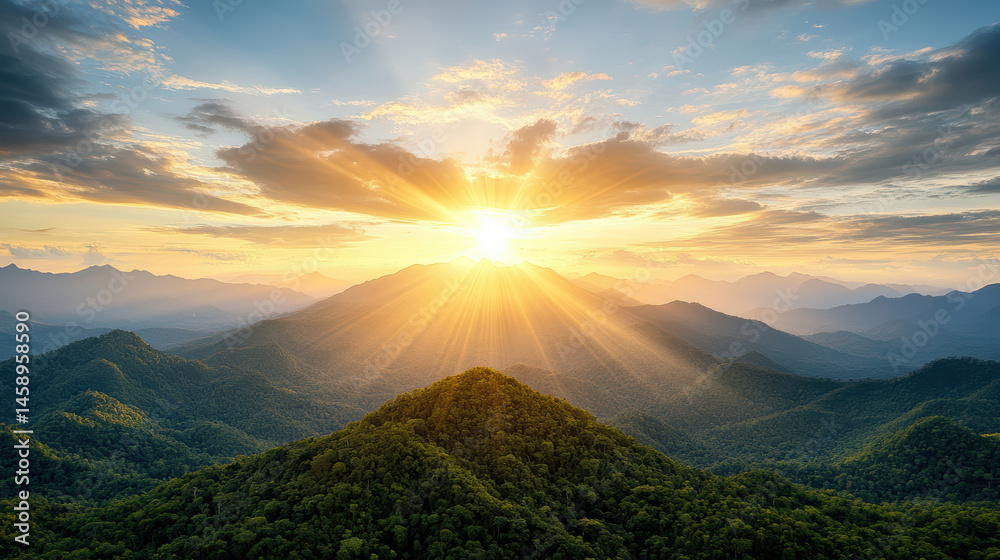 Obraz premium Breathtaking sunset over lush mountains, with rays of sunlight illuminating sky