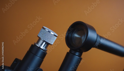 Close-up of an otoscope and ophthalmoscope arranged on a clinical wall panel.