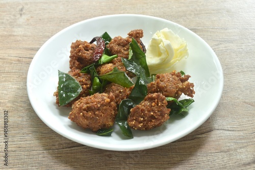 Obraz na płótnie deep fried spicy chop pork ball Thai salad taste spicy and sour with cabbage on plate w salonie