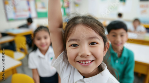 A bright classroom where students are happily using free learning materials provided through public education funding, close up shot, space for text
