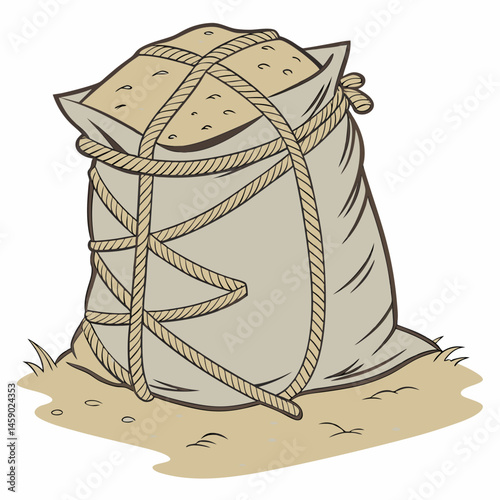 Sandbag filled with earth resting on ground  
