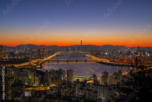 Photography SEOUL, The golden light before sunrise offers a beautiful view of the Han River and Lotte World Tower on Maebongsan Mountain in Seoul, South Korea