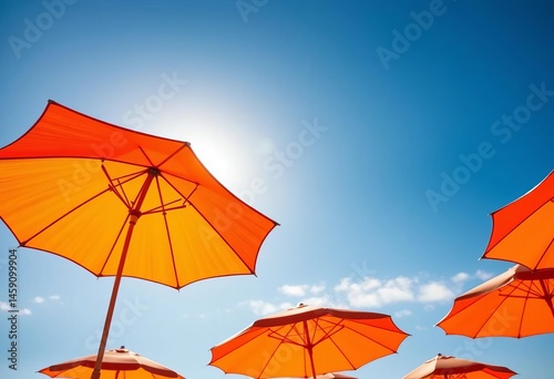 Vibrant orange umbrella silhouetted against a sunny blue sky  Perfect for summer vacation and sun protection themes,   hot weather,  illustration photo