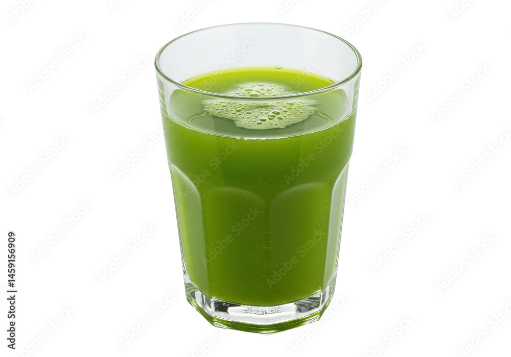 Vibrant green juice with frothy foam in clear glass on a stark black backdrop Vibrant green juice with frothy foam in clear glass on a stark black backdrop
