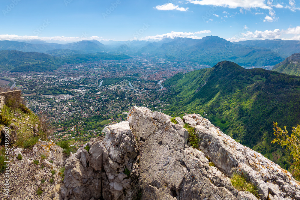Fototapeta premium Elevated view of the city of Grenoble from the Chartreuse massif mountain range. Summer in Isere, Rhone-Alpes region, France
