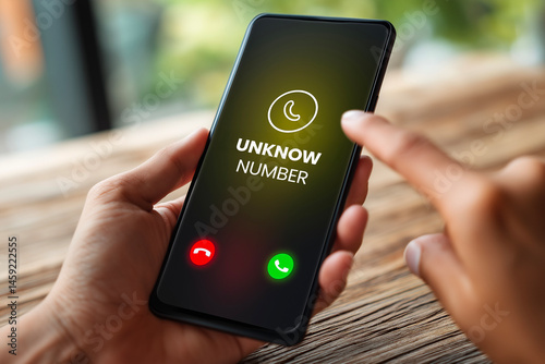 Wallpaper Mural Smartphone displaying incoming call from unknown number, person hesitating to answer, uncertainty and privacy risk concept. Torontodigital.ca