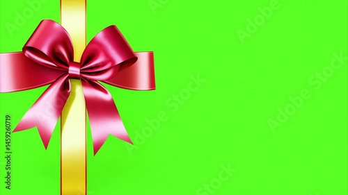 red bow on green background