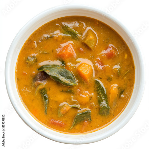 A bowl of vegetable pulissery, with a yogurt-based curry made from vegetables and coconut, isolated photo