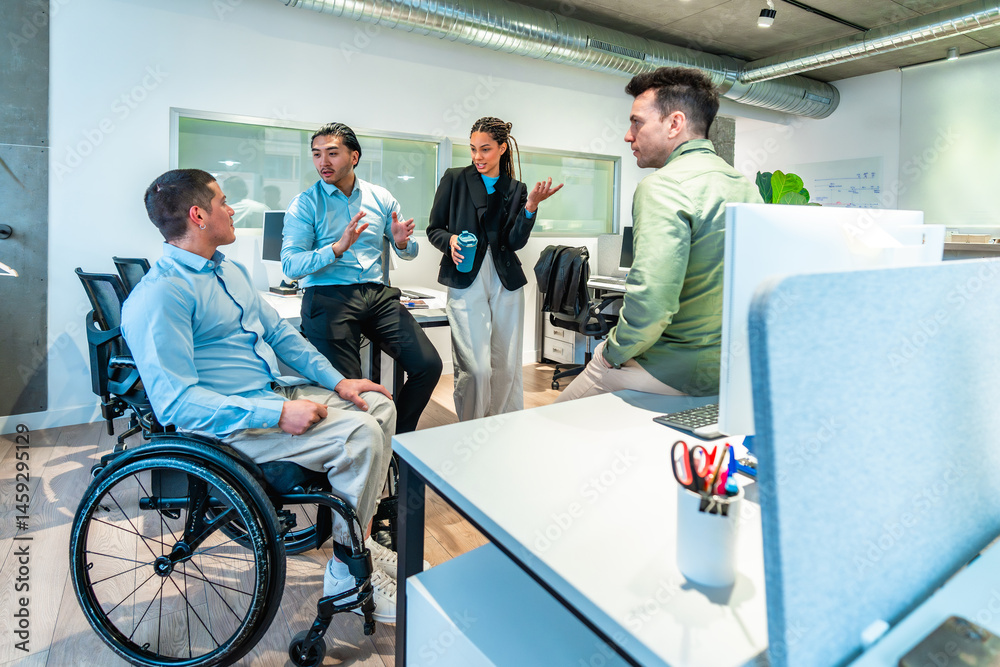 Diverse businesspeople discussing during meeting in modern office with disabled colleague