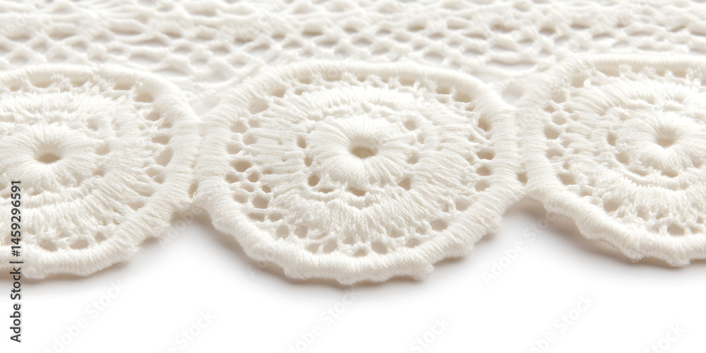 Obraz premium A close-up shot of a delicate, handcrafted trim with circular floral patterns, showcasing its intricate crochet and textural details.
