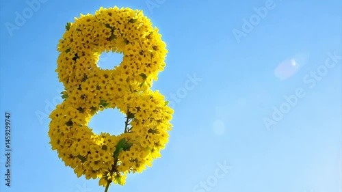 number eight made of yellow flowers in the sky