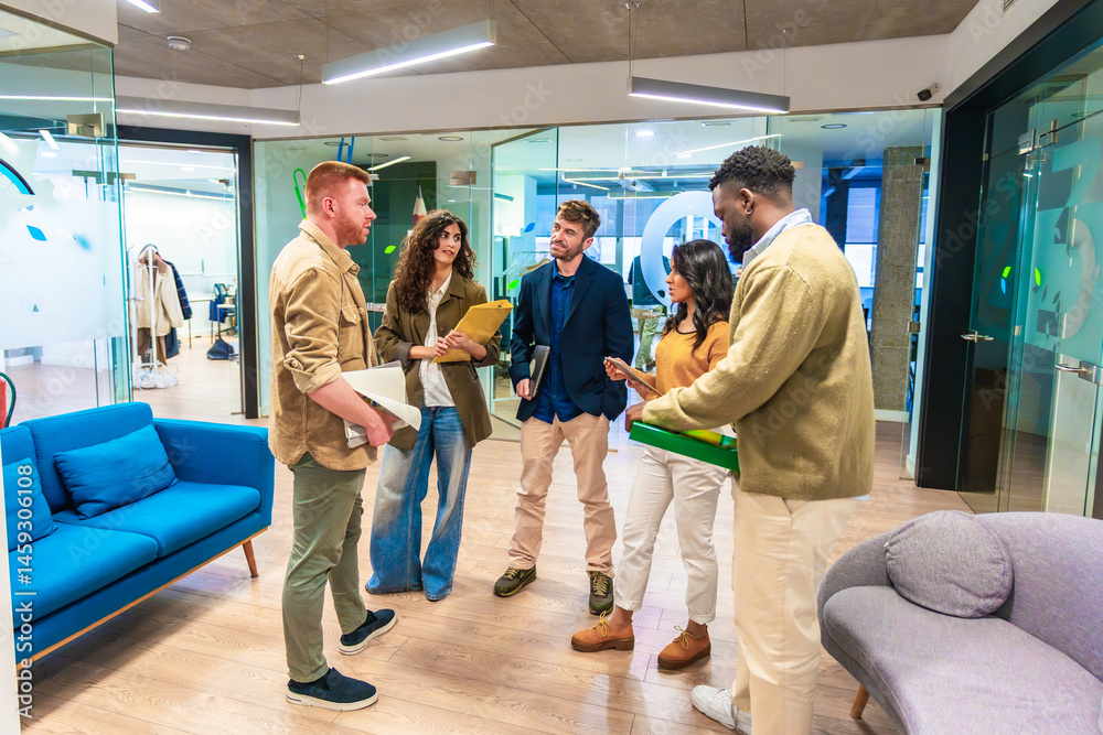Startup team discussing business strategy in modern office