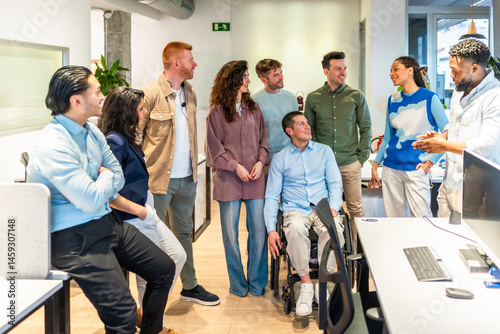 Diverse business team listening to a project manager in a modern office