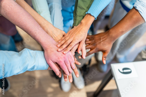 Obraz na płótnie Business team joining hands showing unity and teamwork w salonie