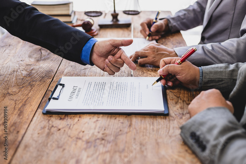 Lawyer mediating dispute, two litigants and businessmen in law office. Signing a contract agreement legal.