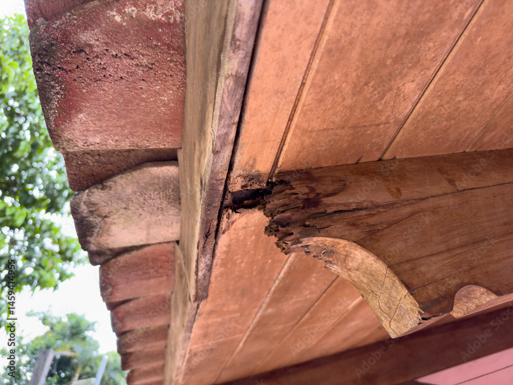 Damaged wooden roof beam