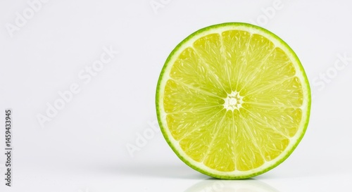 Lime Slice on White Background - Vibrant lime cross-section, showcasing freshness, zesty citrus, juicy fruit, and healthy goodness. Represents summer, refreshment, and vitality