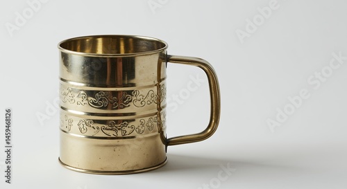 Brass mug with decorative pattern